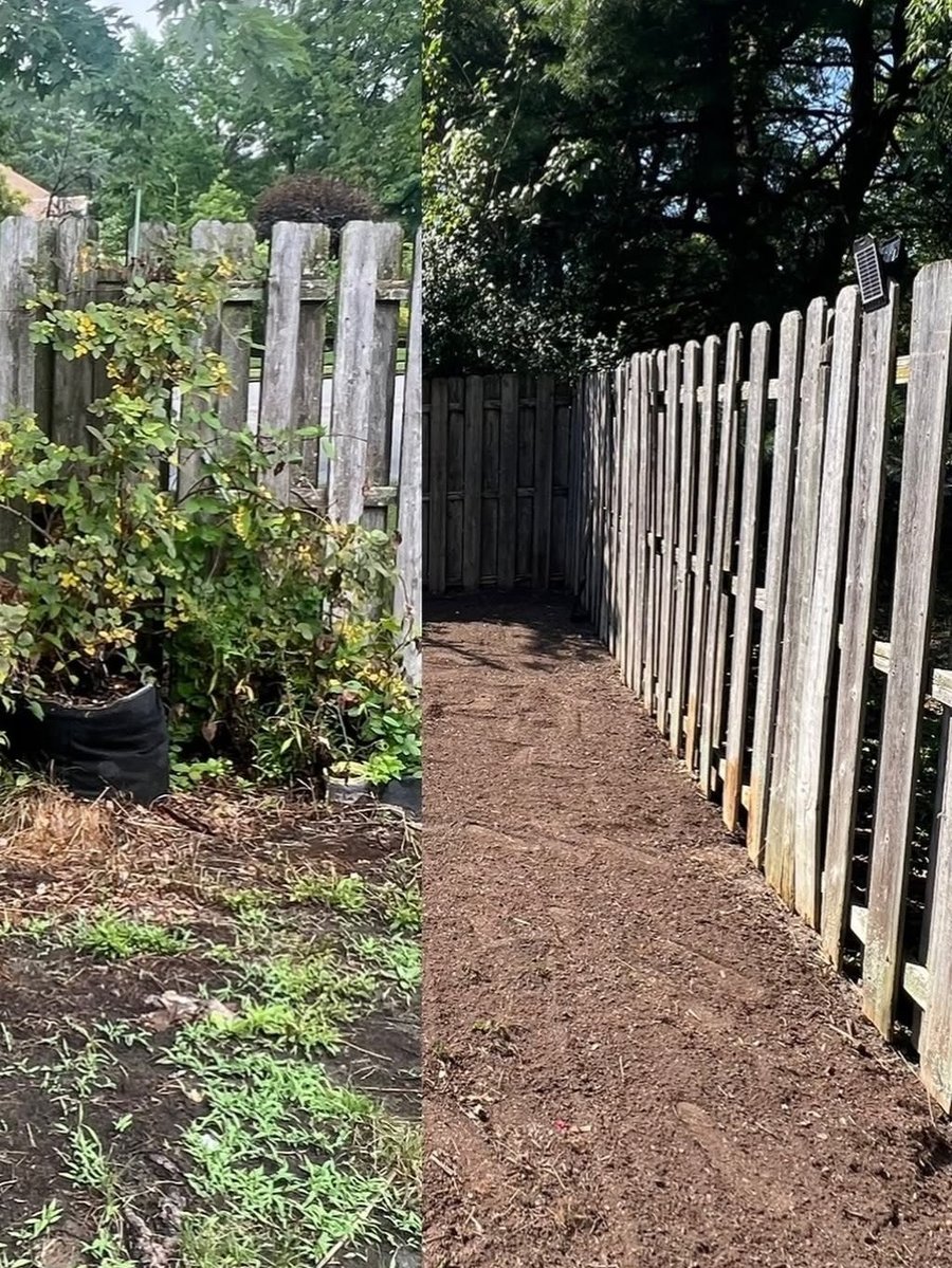 Fresh mulch path along fence line after clean up
